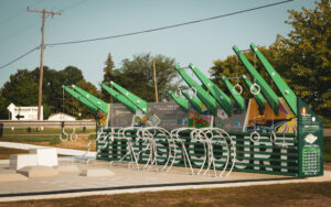 Outdoor fitness court with exercise equipment.