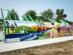 Colorful park mural with nature and wellness themes.