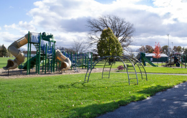 playground photo Sunny playground with slides and climbing structure.