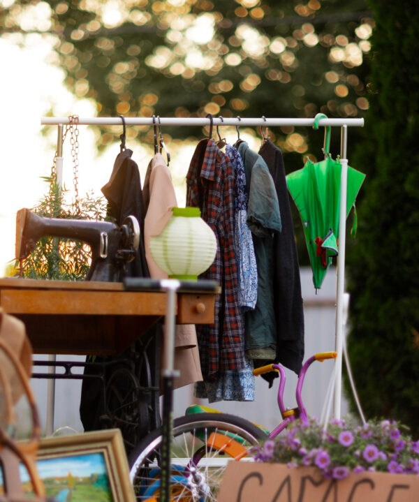 2150661467 Garage sale with clothes and vintage items.