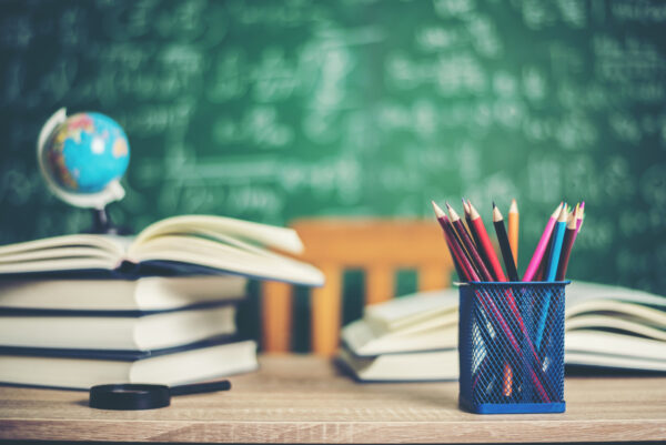 3837 Books and pencils on classroom desk